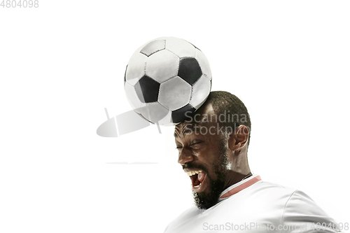 Image of Close up of emotional man playing soccer hitting the ball with the head on isolated white background