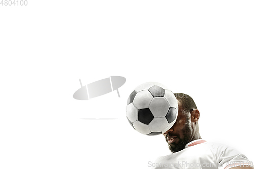 Image of Close up of emotional man playing soccer hitting the ball with the head on isolated white background