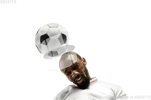 Image of Close up of emotional man playing soccer hitting the ball with the head on isolated white background
