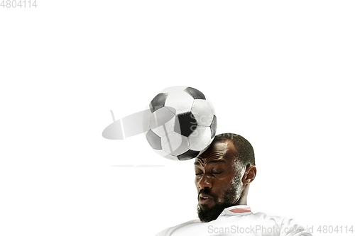 Image of Close up of emotional man playing soccer hitting the ball with the head on isolated white background