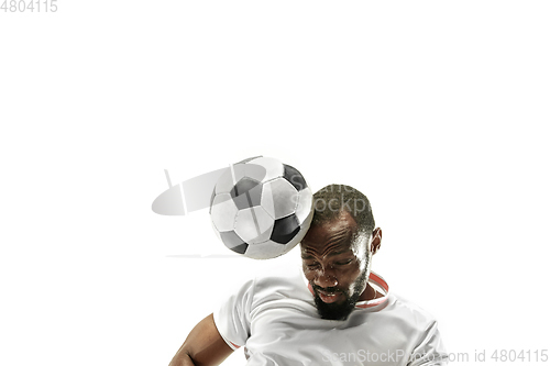 Image of Close up of emotional man playing soccer hitting the ball with the head on isolated white background