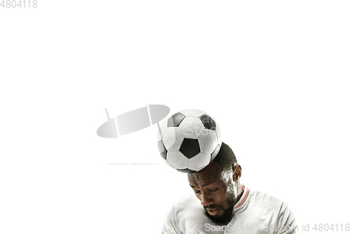 Image of Close up of emotional man playing soccer hitting the ball with the head on isolated white background