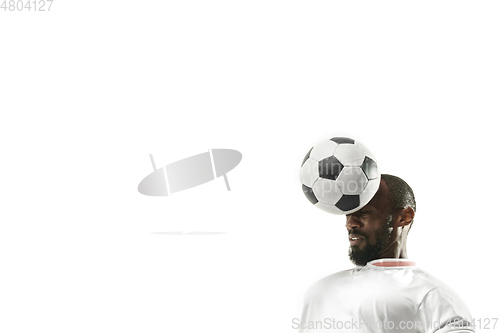 Image of Close up of emotional man playing soccer hitting the ball with the head on isolated white background