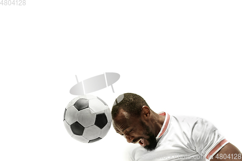 Image of Close up of emotional man playing soccer hitting the ball with the head on isolated white background