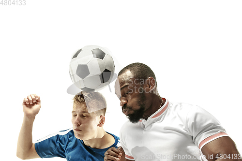 Image of Close up of emotional men playing soccer hitting the ball with the head on isolated on white background