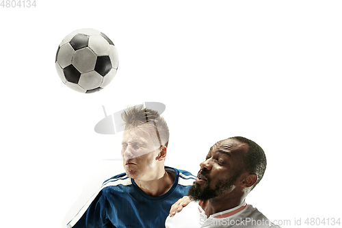 Image of Close up of emotional men playing soccer hitting the ball with the head on isolated on white background