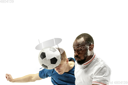 Image of Close up of emotional men playing soccer hitting the ball with the head on isolated on white background