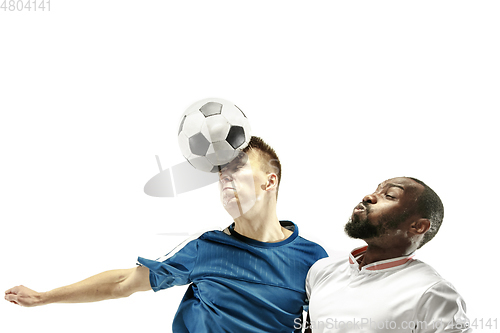 Image of Close up of emotional men playing soccer hitting the ball with the head on isolated on white background