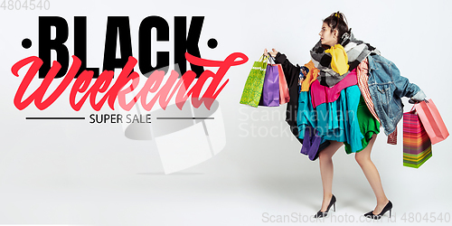Image of Woman addicted of sales and clothes, black weekend, sales concept