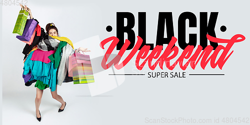 Image of Woman addicted of sales and clothes, black weekend, sales concept