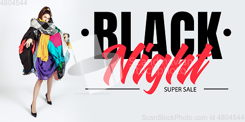 Image of Woman addicted of sales and clothes, black night, sales concept