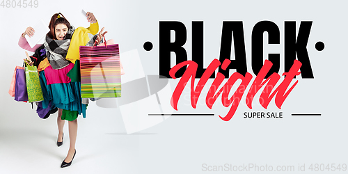 Image of Woman addicted of sales and clothes, black night, sales concept