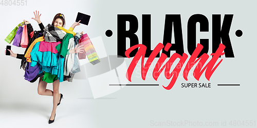 Image of Woman addicted of sales and clothes, black night, sales concept