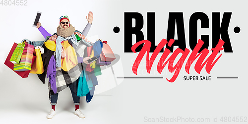 Image of Man addicted of sales and clothes, black night, sales concept