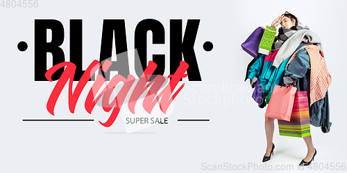 Image of Woman addicted of sales and clothes, black night, sales concept