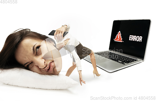 Image of Big head on small body lying on the pillow