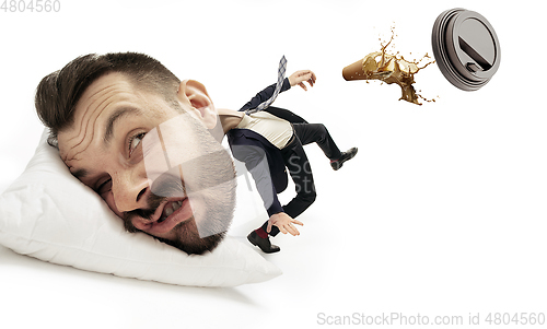 Image of Big head on small body lying on the pillow