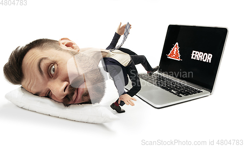 Image of Big head on small body lying on the pillow