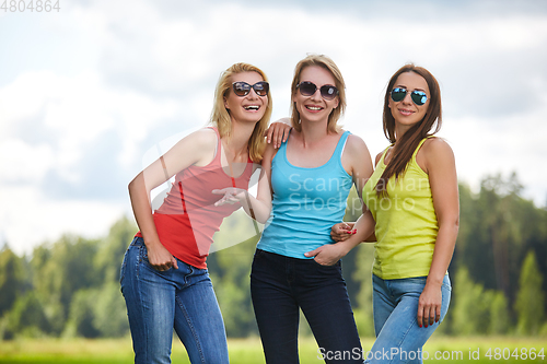 Image of three girls having fun outdoors