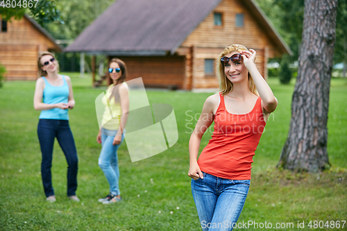 Image of three girls having fun outdoors