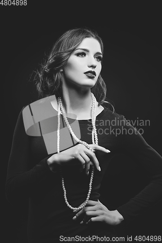 Image of beautiful girl with pearl necklace