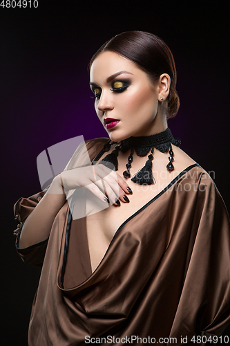 Image of beautiful young woman with dark makeup