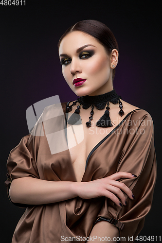 Image of beautiful young woman with dark makeup