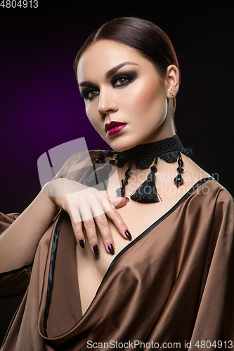 Image of beautiful young woman with dark makeup