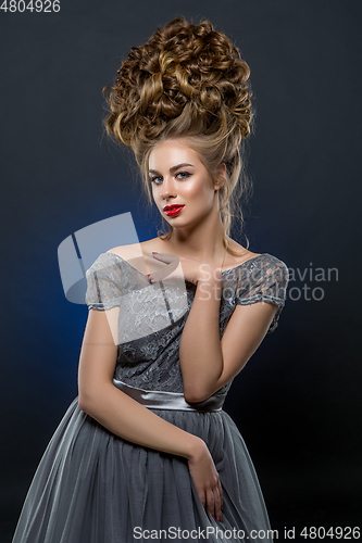 Image of beautiful girl with big curly hairstyle