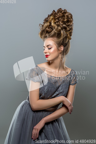 Image of beautiful girl with big curly hairstyle