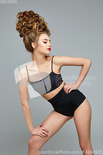 Image of beautiful girl with big curly hairstyle