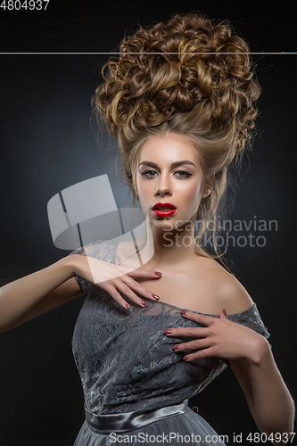 Image of beautiful girl with big curly hairstyle