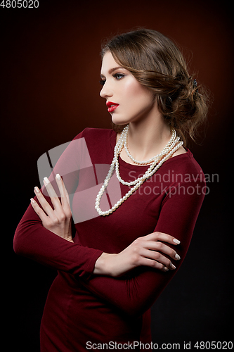 Image of beautiful girl with pearl necklace