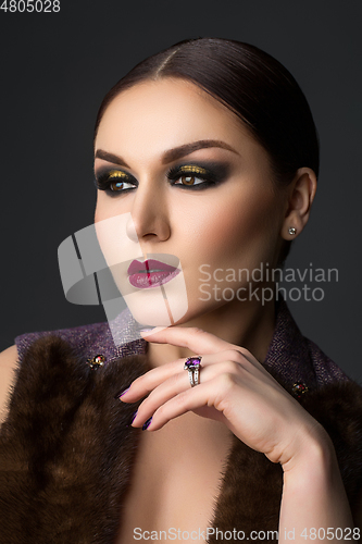 Image of beautiful young woman with dark makeup