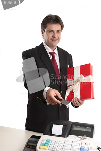 Image of Man paying for persent with card