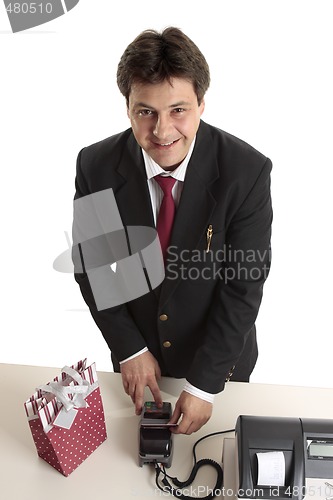 Image of Man buys Christmas present credit card