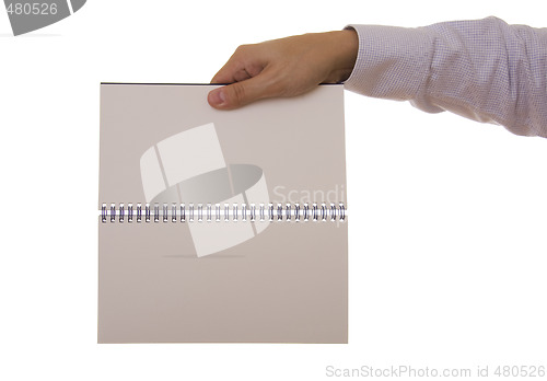 Image of hand and notebook