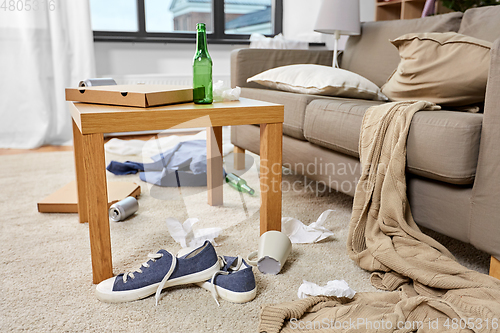 Image of messy home living room with scattered stuff