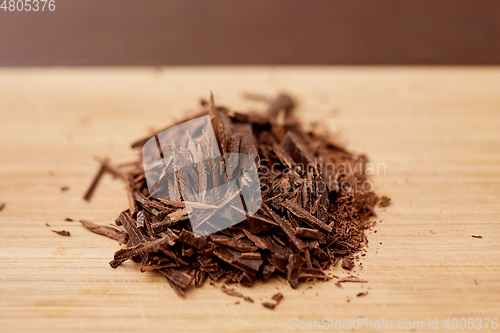 Image of chocolate chips on wooden board