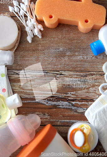 Image of baby accessories for bathing on wooden table