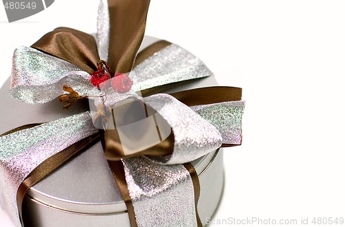 Image of metal gift box with beautiful bow
