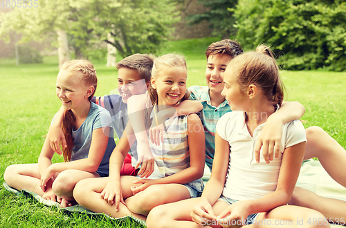 Image of group of happy kids or friends outdoors