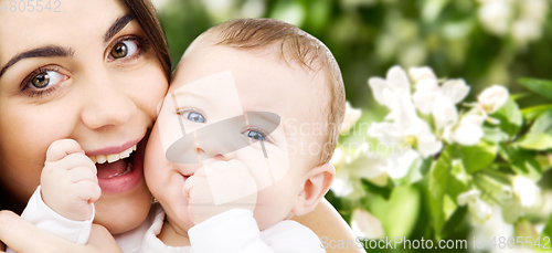 Image of mother with baby over spring garden background