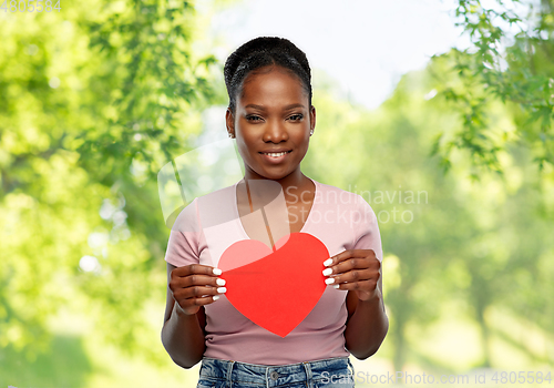 Image of happy african american woman with red heart