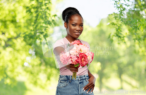 Image of happy african american woman with bunch of flowers