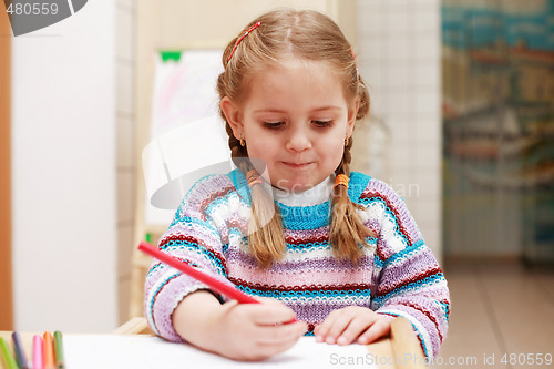 Image of Cute little girl painting