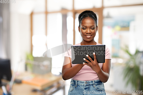 Image of african american woman with tablet pc at office