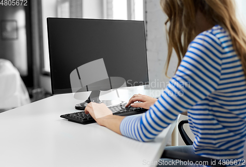 Image of close up of teenage girl with computer at home