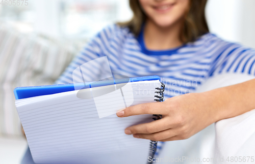 Image of close up of student girl with exercise book