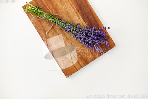 Image of bunch of lavender flowers on wooden board